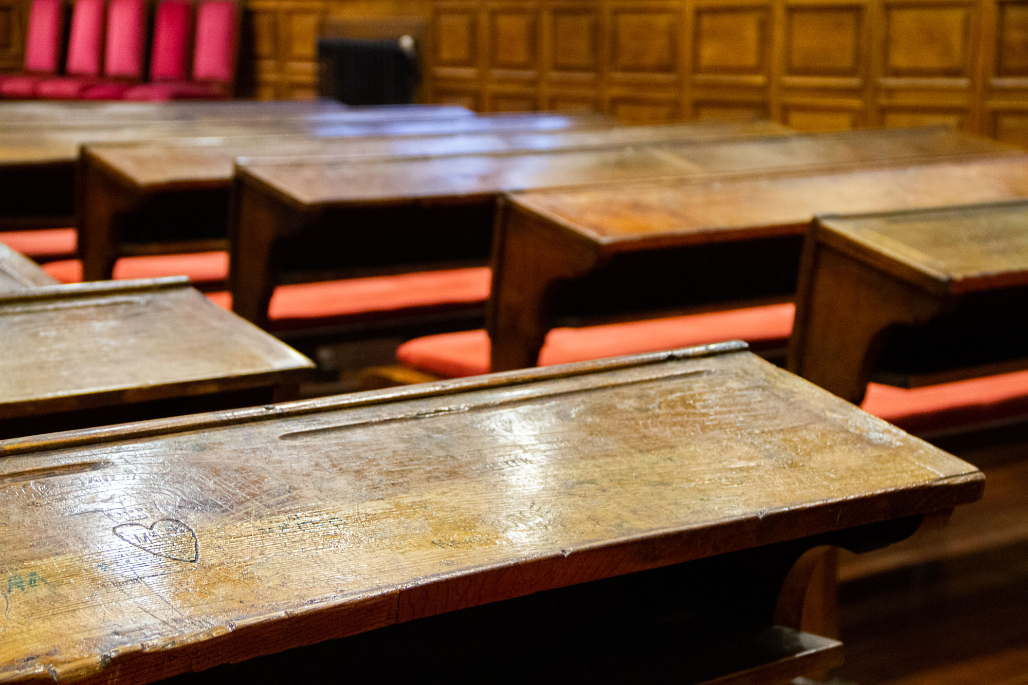 Wooden university desk with carved heart